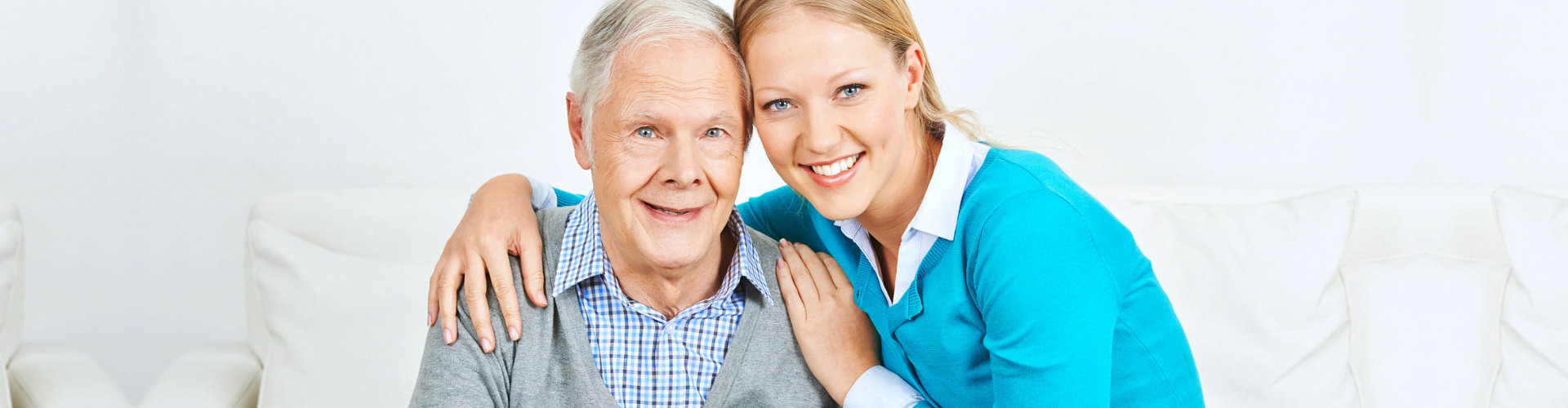 lady caregiver and old man smiling